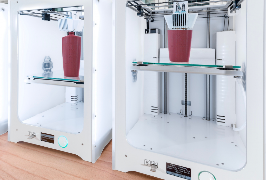 Two 3D printers being used to create L'Oréal prototypes.