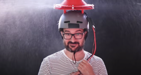 YouTuber Ivan Miranda testing the third version of his turbine umbrella hat.