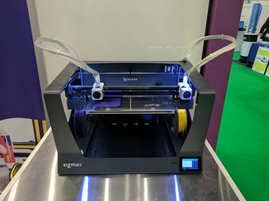 Dual extruders prepare to print either side of the BCN3D Sigmax at TCT 2017. Photo by Michael Petch for 3D Printing Industry