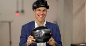 Markus Glasser, SVP of EOS, with the 3D printed Hexo Helmets. Photo via EOS.