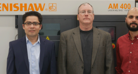 UTSA researchers Arturo Montoya, Harry Millwater and David Restrepo stand in front of the Renishaw 3D printer at the Makerspace in the Science and Engineering Building. Photo via UTSA.